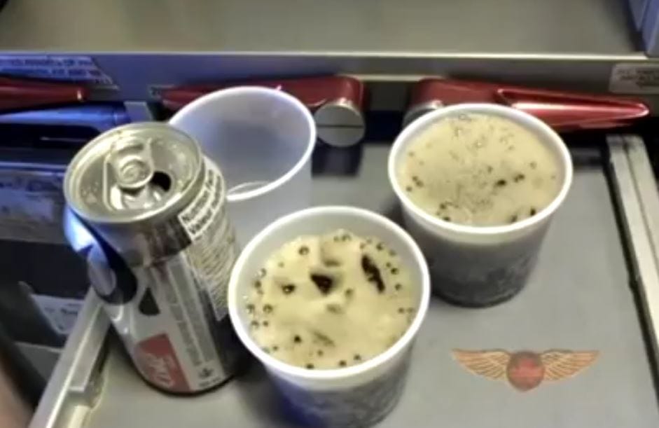 pouring diet coke in a airplane