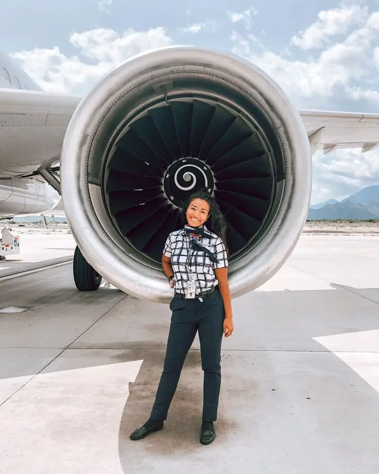 american airlines uniform in front of plane