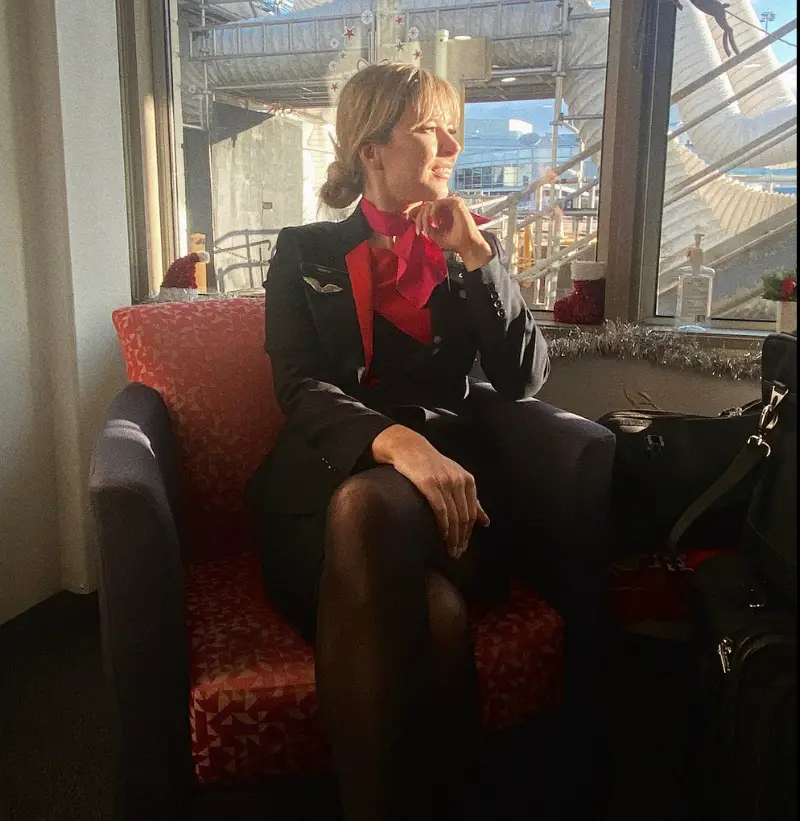 flight attendant in her qantas uniform