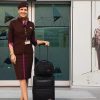 flight attendant with her luggage
