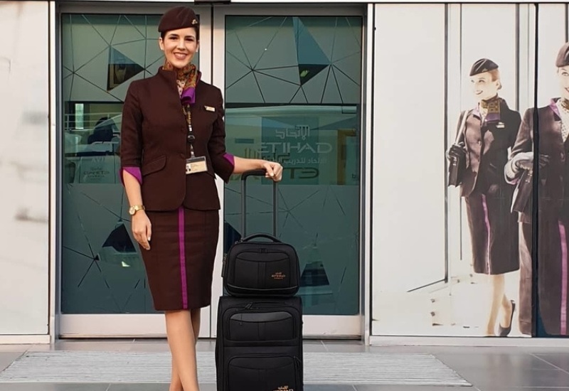 flight attendant with her luggage