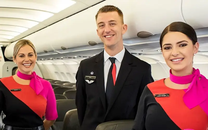 3 qantas cabin crew in uniform